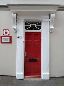 Baines-Ball & Associates red door with white surround